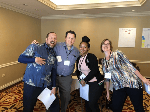 A group of workshop attendees poses for the camera