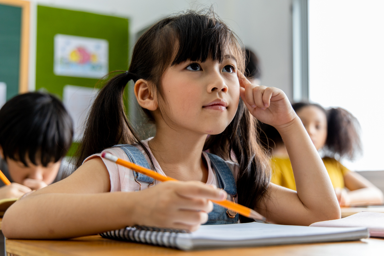 student reflecting in her classroom